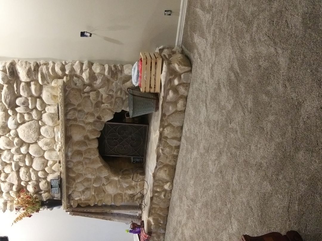 Carpet flooring and custom fireplace